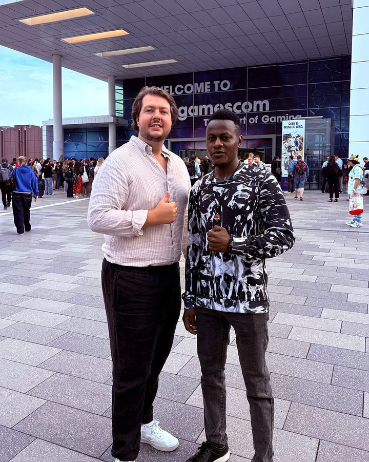 Michael Wambua Nzisa, founder of Manyatta Influence, with a colleague at the entrance to gamescom in Cologne